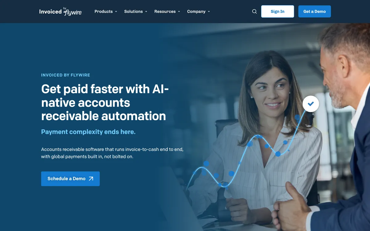 Invoiced by Flywire homepage showing the headline Get paid faster with AI-native accounts receivable automation and a Schedule a Demo button